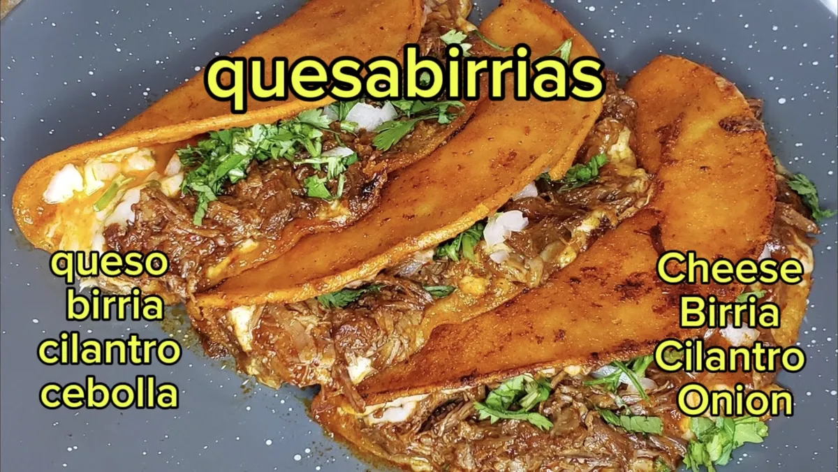 Quesabirrias with cheese, birria, cilantro, and onion