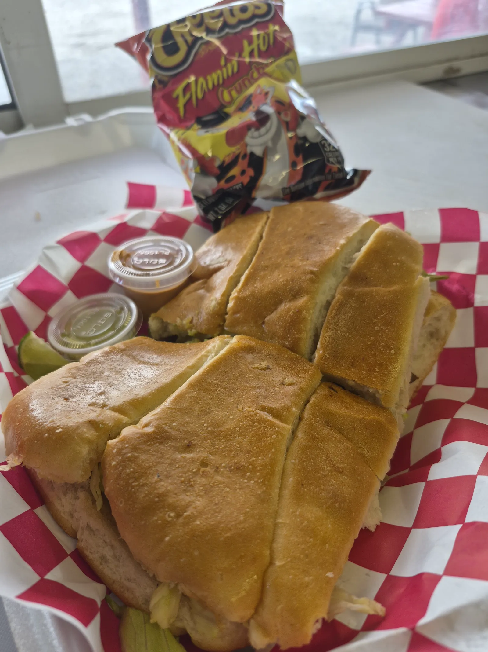 Prepared tortas served with salsa and lime