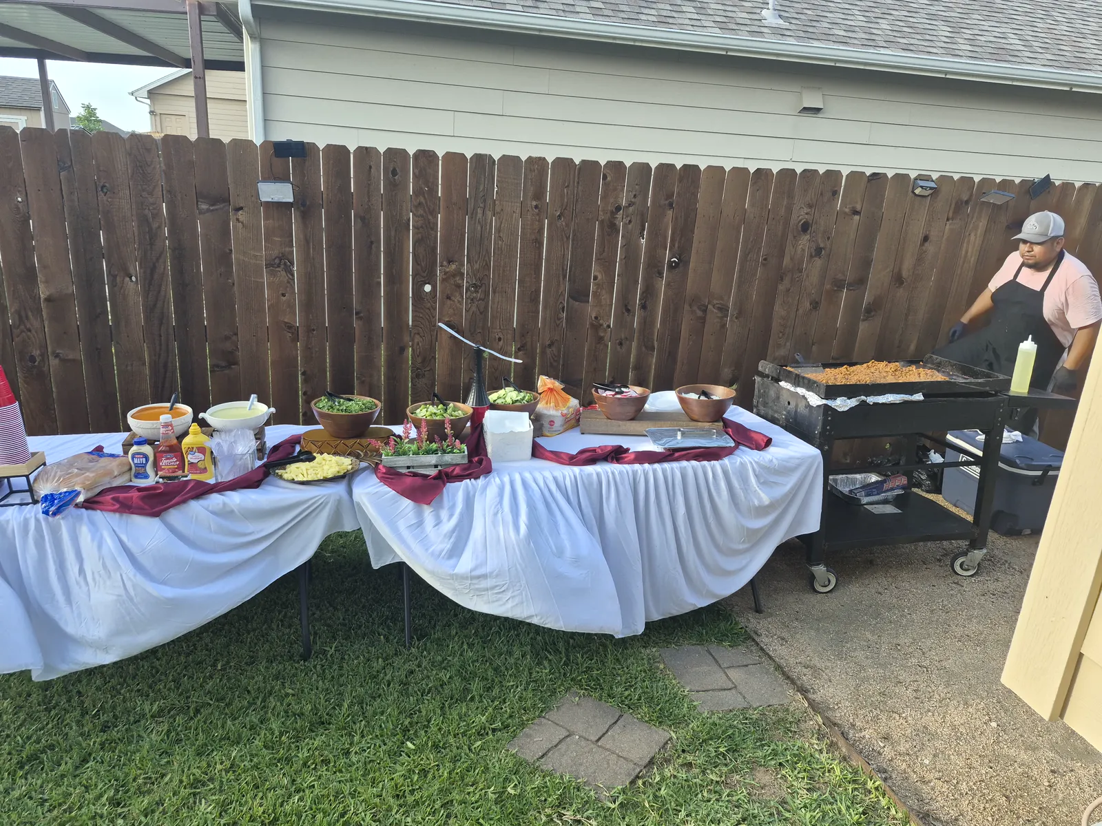 Antojitos Anthony's team member cooking at a catering grill